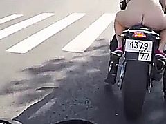 Curvy woman's naked motorbike ride