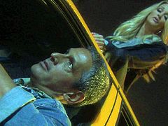Attractive woman Jessica Drake with long blond hair gives blow job in the dark of the night beside a taxi. Lucky man gets his stiff dick polished with her soft warm lips.