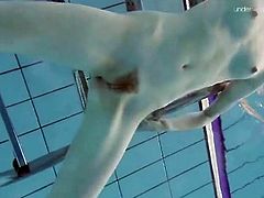 Sexy trimmed pussy on a tall teen swimming in the pool