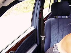 Good looking blonde next door Jessie Sinclair in nice dress flashes her natural boobs in a car and then wraps her soft lips around guys sausage. She gives car blowjob with enthusiasm.