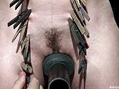Do you like to see tortured women getting brutal orgasms? A slutty bitch with fascinating big tits has her body full of kinky clothespins, while being tied up strongly by a merciless executor. The helpless lady has also been gagged, so there's no way her screams could ever be heard from the cold basement.
