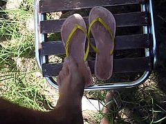 Outdoor Cumshot on soles of flip flop 001