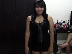 two funny thaigirls kissing in hotelroom