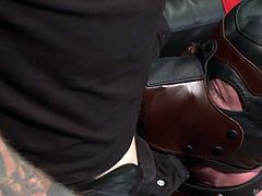 Two tattooed men dominate their slave with their horny cocks. They keep him on a leash, torture the bonded stud and use him in a dirty manner. Watch the man on the floor, crawling at his master's feet. He wears a kinky mask, resembling to a wolf's figure. See him giving head with obedience!