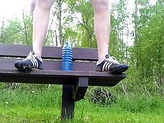 Brutal anal dildo on a park bench