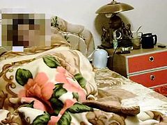 Dude joins his Asian housewife in bed and fires up amateur sex video