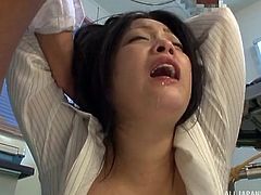 An attractive brunette Japanese is about to get in trouble, as a horny guy can't keep his cock in his pants, while noticing her wonderful big tits. Click to watch this slutty milf, pounded hard from behind!