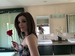 Kierra loves the rose that Rocco got for her, and she knows what that means. The tiny-breasted young sex kitten gets on her knees, managing to work her mouth around Rocco's thick meatstick. After sucking him nicely, she gets bent over and stuffed from behind. Rocco films every minute of this encounter.