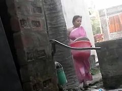 Voyeur - Indian BBW bathes outside