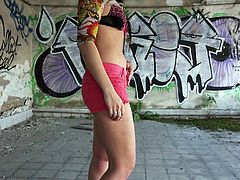 Naughty Russian girl Taissia Shanti in tiny pink shorts flashes her small breasts and exposes her nice pussy with her panties down. Cute brunette shows it all in the backstreet.