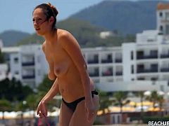 Spy on a topless chick at the beach