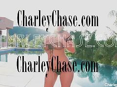 Naturally busty Charley does a quick striptease for the came