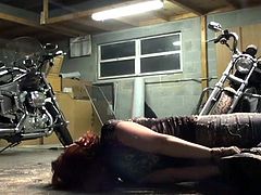Biker girl hogtied in the garage