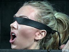 Jeanie heeds her executor's commands, although she cannot see him and she's cinched tight in the device, he has prepared for her. The blindfolded submissive straddles another part of the device, directly in contact with her pussy. What else is in store for this pretty blonde?