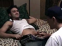 Leaning back on the bed, straight boy Paulie unzips his pants and lets Vinnie blow him. Soon Vinnie takes out his own cock and Paulie starts stroking it. Vinnie scoots up next to him on the bed and Paulie starts sucking his cock as he spies the porno on the TV. Paulie writhes on the bed as he pumps his cum on Vinnies lips.