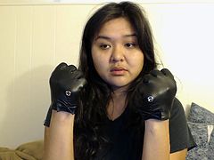 dee tries on leather gloves