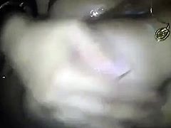 She lets it spill onto her boobs from her mouth and sucks t