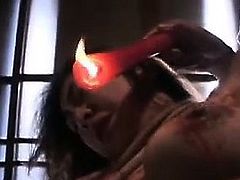 Submissive Asian slut accepts hot wax drippings on her tits