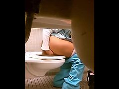 Hiddencam girl put big butt plug in in public toilet