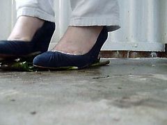 Crushing leaves under wedges high heels