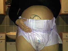Pregnant peeing in her diaper