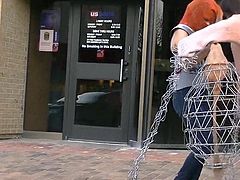 Masked woman does performance art downtown