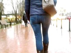 MILF's ass in tight jeans in rainy day