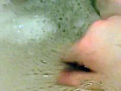girl playing in the bath