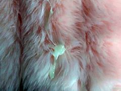 Cumming on a pink faux fur vest