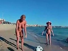 Nude Beach - Four Teens Play Volleyball