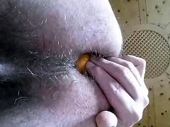 Amateur anal  - guy puts orange in his asshole