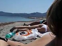 Naughty girl gives a blowjob on the beach