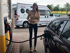 Slim Brunette in Jeans and High Heels at the Gas Station