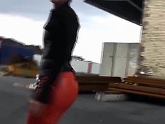 Nice Lady in red leather pants and mini skirt