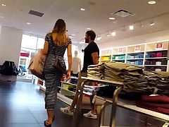 Candid voyeur MILF in tight striped dress shopping