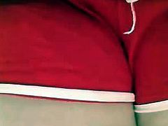 Close-up red shorts peeing 1