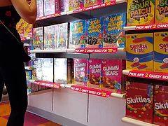 Candid voyeur tight black jeans teen in candy store