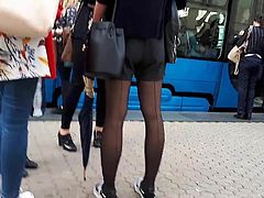 Girl wait for tram 6 black stockings