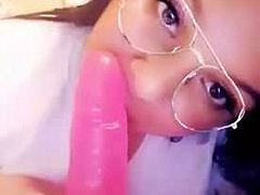 ebony teen sucks pink dildo