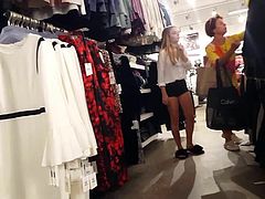 Candid voyeur shopping in tight shorts for lingerie