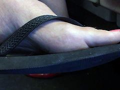 Ultra Close-Up of Women's Feet in Flip Flops