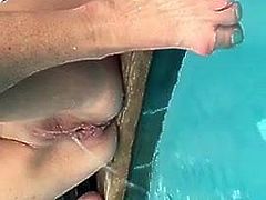 Katherine Ann Brown pisses in a pool with her wrinkled cunt