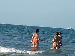 Fat Bottomed Mature Jiggling Down The Beach In Bikini