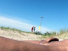 Nudist beach sunbathing, flashing