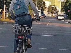 Candid ass in jeans - young girl riding bike