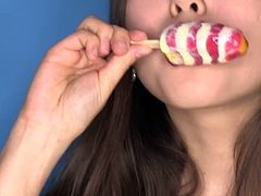 Sexy Li Moon licking her lollipop