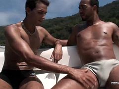 Alan and Matheus are out boating when they pull into a secluded island cove. With no one in sight, the horny Latinos decide to fuck under the hot South American sun. Once the two are naked, Alan goes down on Matheus, who quickly gets hard. Then he hops on that stiff dick for a raw ride, before Matheus bends him over and fucks his Latin bottom from behind. The two continue their bareback romp until Alan cums on himself. Then Matheus pulls out and pumps a gusher onto Alans face.