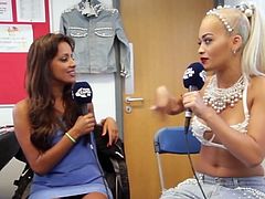 Rita Ora shows off abs and talks fitness