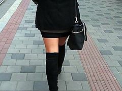 Pantyhose with overknee boots on the street