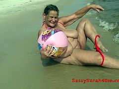 Saggy tits woman with a beach ball